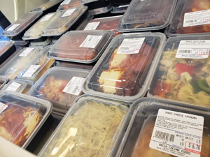 Display case of pre-made lunch and dinner meals available at Bella Cucina Foods in West Chester, PA