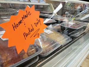 Display case of homemade pre-made meals available at Bella Cucina Foods in West Chester, PA